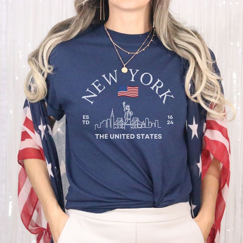 New York Skyline T-Shirt, US Flag Shirt, NYC Skyline Tee, Patriotic NYC Shirt, American Flag Apparel, NYC Skyline Graphic Tee, Statue of Liberty Shirt, NYC Landscape Shirt, Empire State Shirt, NYC Flag Tee, New York City Graphic Tee,