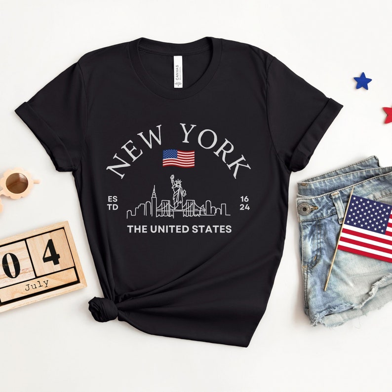 New York Skyline T-Shirt, US Flag Shirt, NYC Skyline Tee, Patriotic NYC Shirt, American Flag Apparel, NYC Skyline Graphic Tee, Statue of Liberty Shirt, NYC Landscape Shirt, Empire State Shirt, NYC Flag Tee, New York City Graphic Tee,