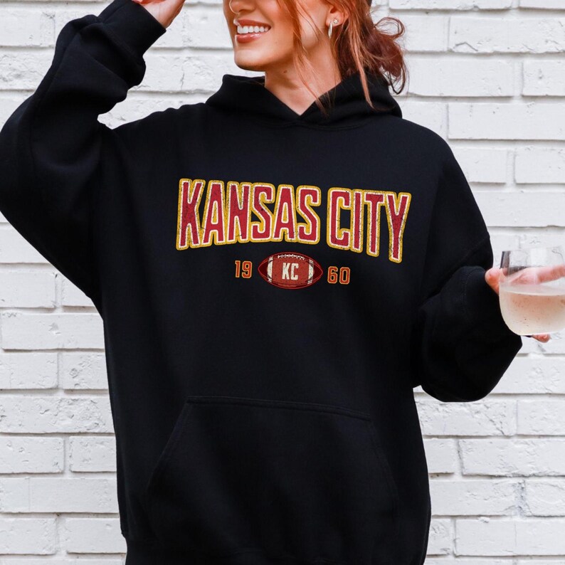 Varsity-style Chiefs hoodie for Kansas City football fans. Perfect for tailgates, Sunday football, or everyday wear. A cozy sweatshirt designed for football fanatics, showcasing Chiefs fandom and making a great fan gift.
