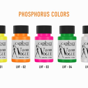 May include: Five bottles of leather paint in various colours: yellow, orange, pink, green, and white. Each bottle has a black lid and a label with the words "Cadence Art & Hobby Paints" and "Leather Vogue". The bottles are labelled with the following codes: LVF-01, LVF-02, LVF-03, LVF-04, and LVU-05.