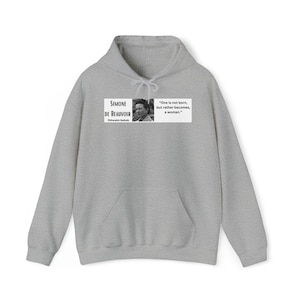 Simone de Beauvoir - Becomes a woman quote Unisex Heavy Blend™ Hooded Sweatshirt