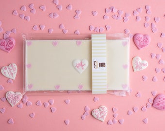 White chocolate bar with sugar hearts