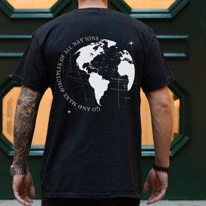 May include: Black t-shirt with a white graphic of a globe and the text "Go and make disciples of all nations".