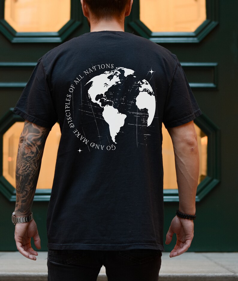 May include: Black t-shirt with a white graphic of a globe and the text "Go and make disciples of all nations".