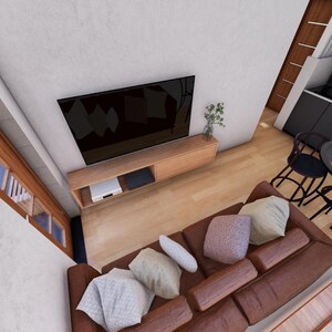 May include: An overhead view of a modern living room with a brown leather sofa, a large black television, and a small dining area. The room has light-colored walls and wooden accents, creating a contemporary aesthetic.