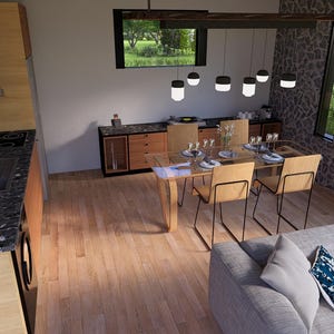 May include: Interior view of a modern dining and kitchen area. The kitchen features wooden cabinets and a black countertop. A dining table with chairs is set up near a window. A gray sofa with decorative pillows is in the foreground.