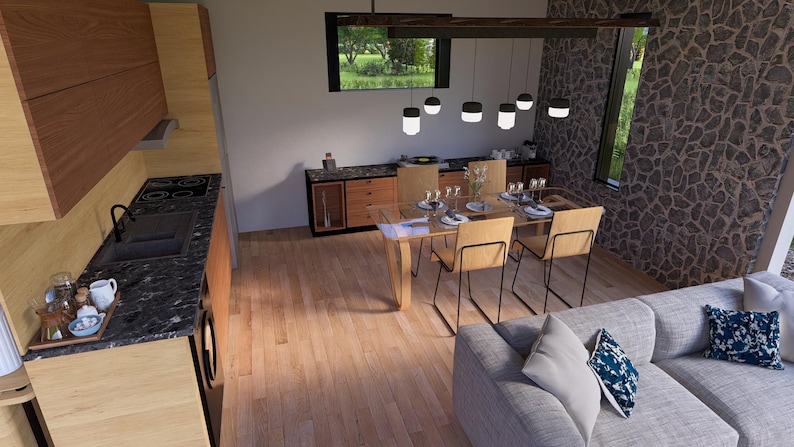 May include: Interior view of a modern dining and kitchen area. The kitchen features wooden cabinets and a black countertop. A dining table with chairs is set up near a window. A gray sofa with decorative pillows is in the foreground.