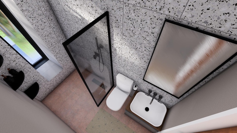 Peut inclure: Vue a&eacute;rienne d'une salle de bain moderne avec douche, toilettes et lavabo. La douche a un cadre noir, et les murs et le sol ont un motif mouchet&eacute;. Un grand miroir est &agrave; droite et une fen&ecirc;tre &agrave; gauche.
