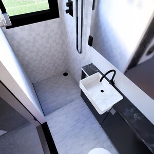 以下が含まれることがあります： 白い洗面台、黒い蛇口、シャワー設備を備えたモダンなバスルームインテリア。 シャワーエリアは白いタイルで、部屋には窓と濃い色のキャビネットがあります。 全体的なデザインはミニマリストで現代的です。