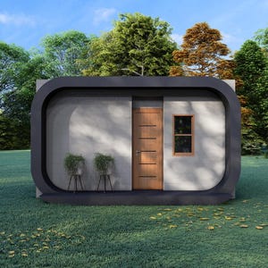May include: A modern, minimalist cabin with a dark gray rounded frame. The cabin has a wooden door, a small window, and two potted plants. The structure is set on a grassy lawn, surrounded by trees under a blue sky.