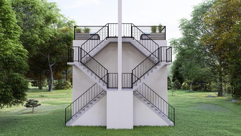 May include: A symmetrical architectural structure with two sets of stairs, each ascending from opposite sides. The stairs are concrete with black metal railings. The structure is set in a grassy area with trees in the background.