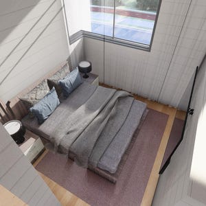 Puede incluir: Vista a&eacute;rea de un dormitorio con una cama cubierta con una manta y almohadas grises. La habitaci&oacute;n tiene una ventana grande y una claraboya. Dos mesitas de noche peque&ntilde;as con l&aacute;mparas a ambos lados de la cama. La habitaci&oacute;n tiene una paleta de colores neutros.