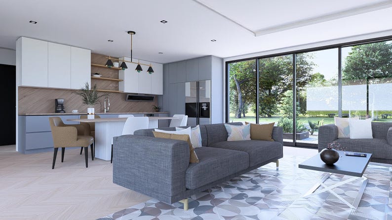 May include: Contemporary living room with a grey sofa, black coffee table, and a kitchen in the background. Large windows offer views of a green outdoor area. The decor is minimalist and modern, with a neutral colour palette.