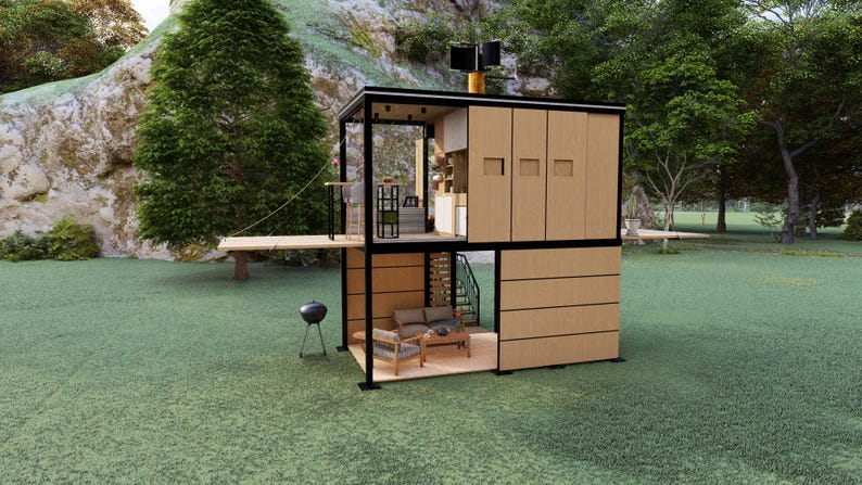 Pu&ograve; includere: Una moderna casetta a due piani con struttura nera e pannelli in legno. La casa &egrave; dotata di un piccolo terrazzo esterno, un barbecue e una piccola area salotto. La struttura &egrave; situata su un prato.