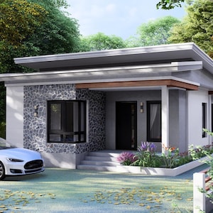 May include: A contemporary bungalow with a white facade and a stone feature wall. A white car is parked in front of the house. The property features a flat roof, a covered porch, and surrounding greenery. The house has a modern design.
