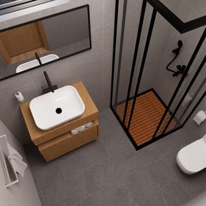 May include: Modern bathroom design featuring a white rectangular sink with a black faucet, set on a wooden cabinet. A black-framed shower enclosure with a wooden floor is adjacent to a white toilet. The room has gray tiled floors and walls.