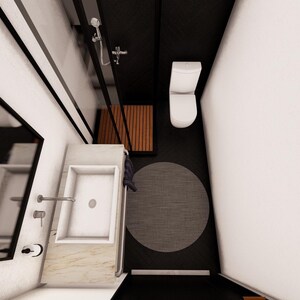 May include: An overhead view of a modern bathroom with a white toilet, sink, and shower. The floor is black, with a gray circular rug. A wooden bench is near the shower. The walls are white and black.