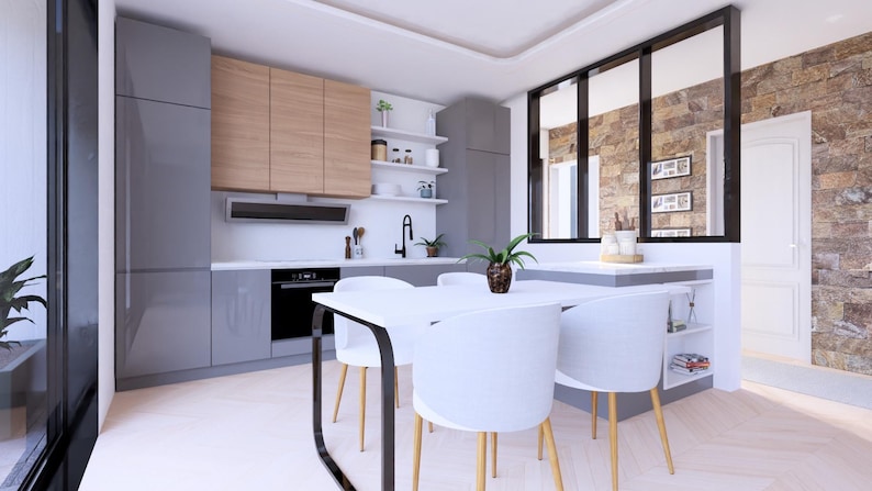 Peut inclure: Cuisine moderne avec des meubles gris, des &eacute;l&eacute;ments muraux en bois clair et un plan de travail blanc. Une table blanche avec quatre chaises blanches et des pieds en bois est au premier plan. Une fen&ecirc;tre &agrave; cadre noir et un mur en pierre sont visibles.