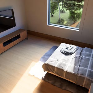 May include: A modern bedroom interior with a bed, nightstands, and a wall-mounted television. The bed has a gray and white patterned comforter. A wooden media console sits below the TV. A large window offers a view of trees.