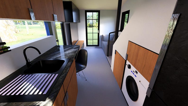 以下が含まれることがあります： キッチンとランドリーエリアを備えたモダンなタイニーハウスのインテリアビュー。キッチンには黒いシンク、カウンタートップ、木製キャビネットがあります。洗濯機はランドリーエリアの近くに見えます。窓とドアから自然光が入ります。