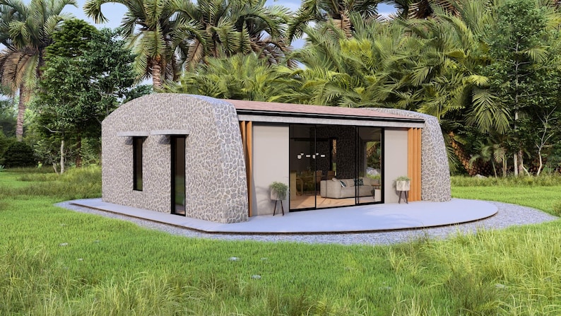 May include: A modern, single-story home with a stone exterior and large glass sliding doors. The roof is brown, and the home is surrounded by lush greenery, including palm trees and grass. The home has a minimalist design.