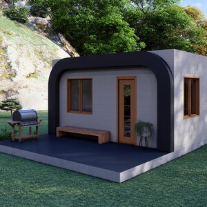 May include: A modern, minimalist tiny house with a black curved roof and trim. It features a wooden door and windows, a small bench, and a grill on a patio. The house is set on a green lawn.