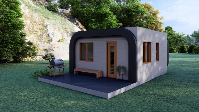 May include: A modern, minimalist tiny house with a black curved roof and trim. It features a wooden door and windows, a small bench, and a grill on a patio. The house is set on a green lawn.