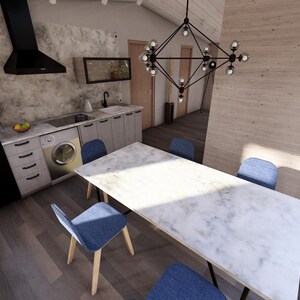 Puede incluir: Vista interior de una cocina y comedor modernos. Cuenta con una mesa de comedor con tapa de m&aacute;rmol y sillas azules, una cocina con lavadora y una campana extractora negra. Una l&aacute;mpara decorativa cuelga sobre la mesa.