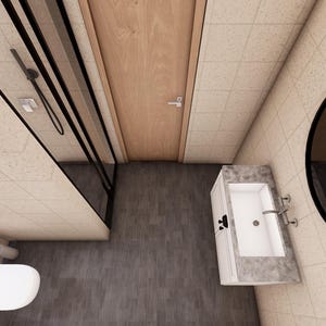 Puede incluir: Vista a&eacute;rea de un ba&ntilde;o moderno con ducha, inodoro y tocador. La ducha tiene un marco negro y una puerta de cristal. El tocador tiene un lavabo blanco y una encimera de m&aacute;rmol. Un gran espejo redondo cuelga de la pared.