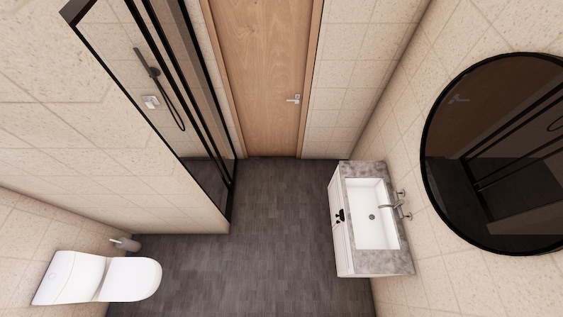 Puede incluir: Vista a&eacute;rea de un ba&ntilde;o moderno con ducha, inodoro y tocador. La ducha tiene un marco negro y una puerta de cristal. El tocador tiene un lavabo blanco y una encimera de m&aacute;rmol. Un gran espejo redondo cuelga de la pared.