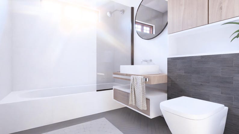 Puede incluir: Interior de ba&ntilde;o moderno con ba&ntilde;era, lavabo e inodoro blancos. La habitaci&oacute;n cuenta con un espejo grande, gabinetes de madera y una pared de acento de azulejos grises. Una toalla cuelga del lavabo. El suelo tiene un patr&oacute;n de espiga gris.