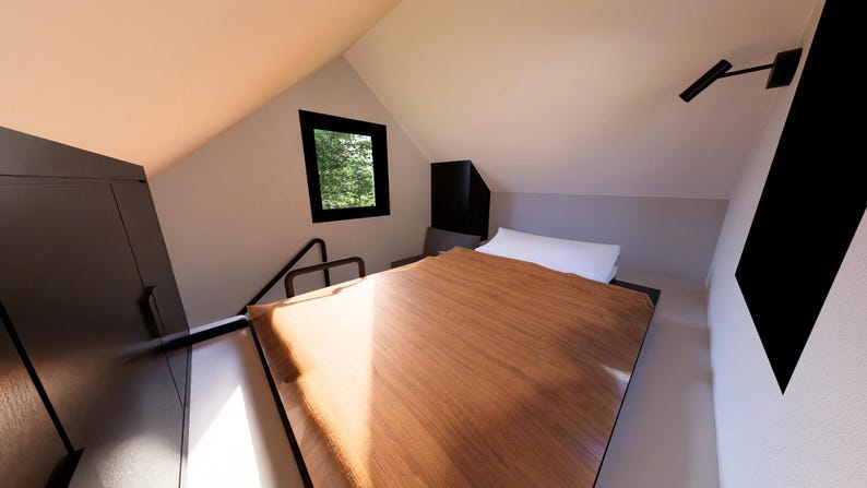 以下が含まれることがあります： 木製のベッドと明るい茶色の木製表面を備えた小さな寝室のインテリア。白い枕がベッドに置かれています。黒い窓と黒いキャビネットが見えます。部屋には傾斜した天井があります。