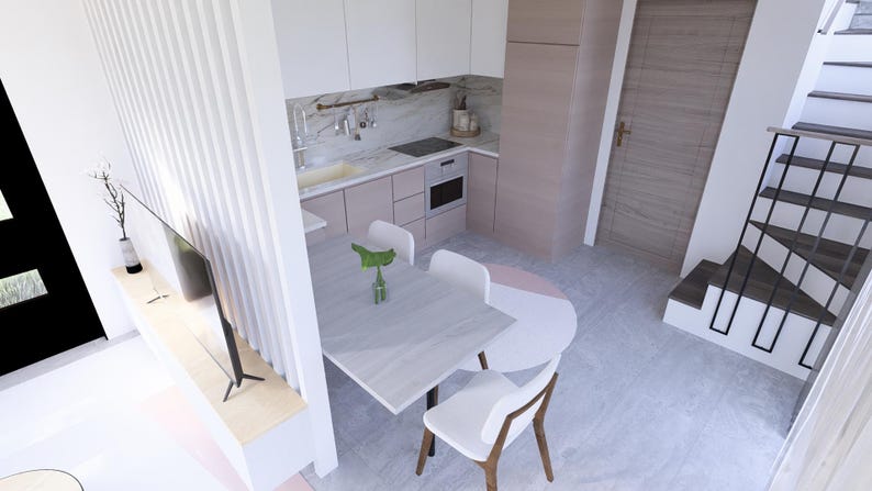 Op de afbeelding: Een moderne keuken en eethoek met een licht kleurenschema. De keuken heeft witte kasten, een marmeren achterwand en roestvrijstalen apparatuur. Een kleine tafel met witte stoelen is ingericht om te dineren. Een trap leidt naar de bovenverdieping.