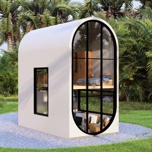 May include: A contemporary, white, two-storey tiny house with a curved roof and large, arched windows with black frames. The house is set amongst lush greenery and palm trees, with a gravel path leading to it.