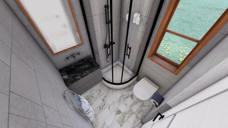 May include: An overhead view of a modern bathroom with gray tile walls and marble flooring. A black-framed shower enclosure is in the center, with a white toilet to the right. A window with a wooden frame is visible, and a rectangular mirror hangs above a dark sink.