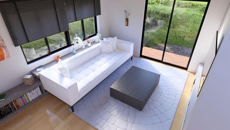Puede incluir: Un sal&oacute;n moderno con un sof&aacute; blanco, una mesa de centro gris y una alfombra gris claro. Grandes ventanas con persianas oscuras ofrecen vistas al exterior. Estanter&iacute;as y objetos decorativos completan el ambiente.