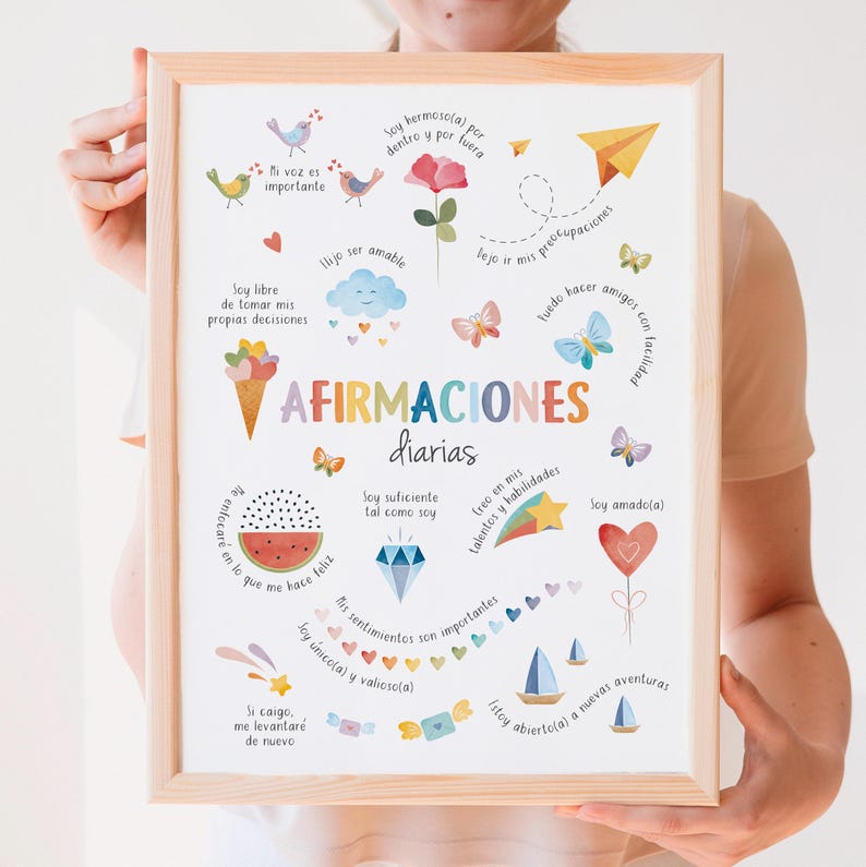 May include: A framed print with colorful illustrations and text in Spanish. The artwork features a variety of images, including birds, butterflies, a cloud, and a watermelon slice. The text includes the words "AFIRMACIONES diarias" and other affirmations.