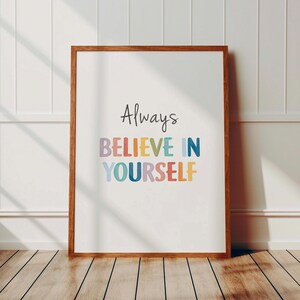 May include: A framed print with the text "Always Believe In Yourself" in colorful letters on a white background.