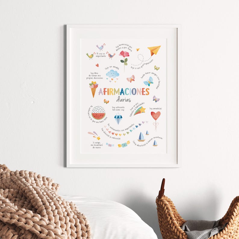 May include: A framed art print with the words "Afirmaciones Diarias" in the center, surrounded by colorful illustrations of birds, flowers, butterflies, and other whimsical elements. The print is in a white frame.