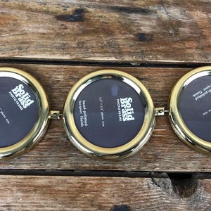 May include: A rustic wooden sign with the text "Welcome to our home" in white lettering. The sign features a distressed finish and a simple, inviting design, perfect for a front porch or entryway.