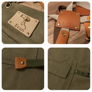 Op de afbeelding: Een groene canvas schort met bruine leren banden en een gepersonaliseerde patch met de tekst "Evan". De patch heeft een f&ouml;hn-icoon.