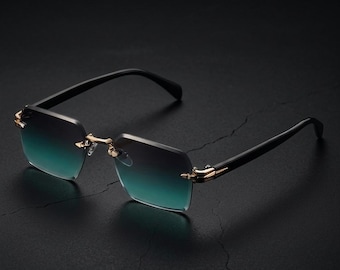 Occhiali da sole rettangolari senza montatura, stile anni '90 con lenti sfumate dorate e protezione UV400.