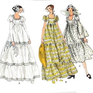 May include: A vintage sewing pattern for a maxi dress with three different styles. The dress features a square neckline, puff sleeves, and a tiered skirt. The pattern includes a white dress with a floral trim, a yellow and white striped dress, and a floral print dress.