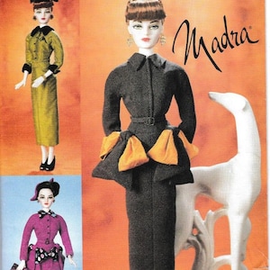 May include: Vogue Doll Collection pattern featuring three doll designs. The designs include a green dress, a black dress with orange accents, and a pink suit. The pattern number is 7382.