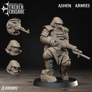 Könnte beinhalten: Eine detaillierte, beige Miniaturfigur eines Soldaten in futuristischer Rüstung, der ein Gewehr hält. Die Figur kniet auf einem schwarzen Sockel. Der Text "Ashen Armies" und "Compatible with Trench Crusade" sind sichtbar.