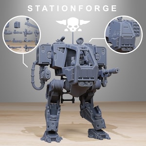 May include: A gray, 3D-printed mech model with a detailed cockpit and weaponry. The model features articulated legs and arms, with additional weapon attachments shown in a circular inset. The text "STATIONFORGE" is at the top.