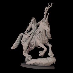 May include: A detailed, gray figurine of a person riding a unicorn. The rider holds a sword and wears a long coat. The unicorn is adorned with floral and rope details, and a skull with antlers is attached to its horn. The figurine is mounted on a stone base.