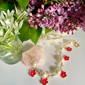 Single Strand Charm Style Bracelet with Round Shiny Gold Plated Toggle Clasp, White Pearls, Pink Pansy Charms, Czech Glass, Gold Accents