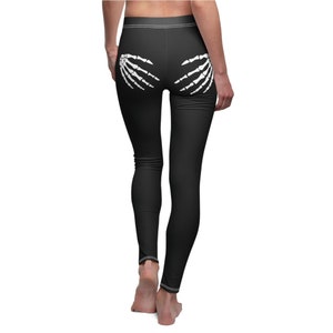 rear view of playful black leggings showing two skeleton hands on the rear