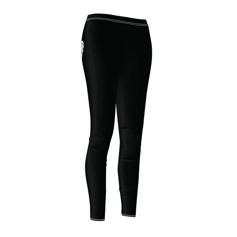 front three quarter view of black leggings with skeleton hand barley visible.